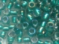 Preview: 11/0 10g TOHO Rocailles Rainbow Crystal Teal Line